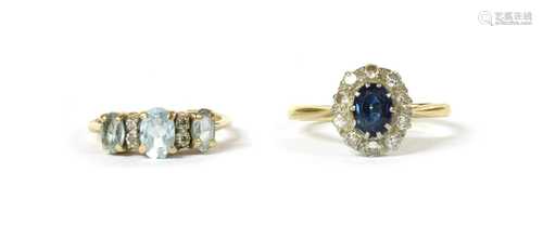 A gold sapphire and diamond cluster ring,