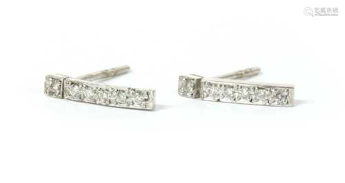 A pair of 18ct white gold diamond set bar earrings,