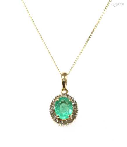 A gold emerald and diamond pendant,