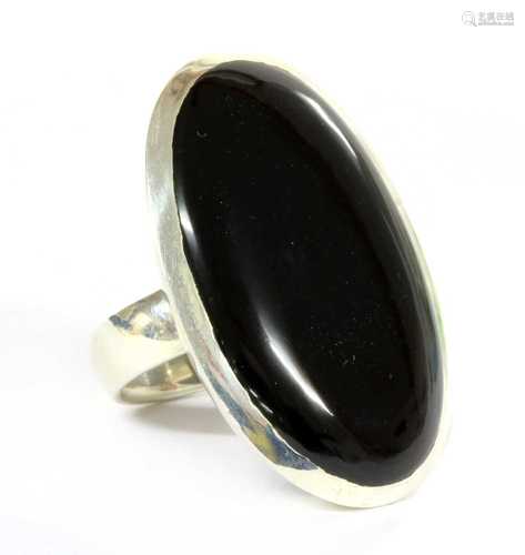 A large silver onyx ring,