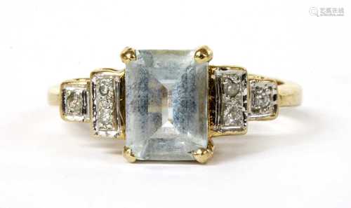 A gold aquamarine and diamond ring,