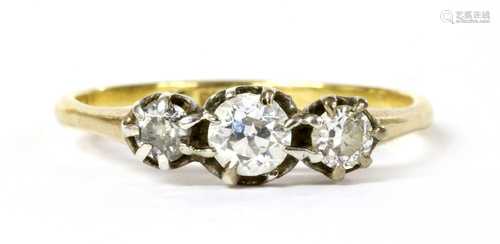 A gold three stone diamond ring,