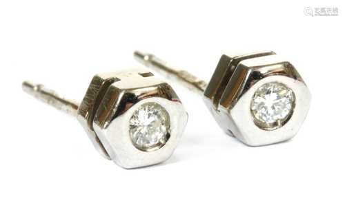 A pair of 18ct white gold single stone diamond stud earrings...