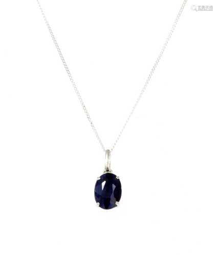 A white gold single stone sapphire pendant,