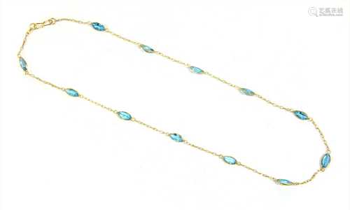 A gold blue topaz rivière necklace,