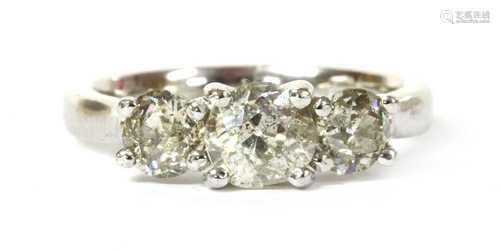 An 18ct white gold three stone diamond ring,