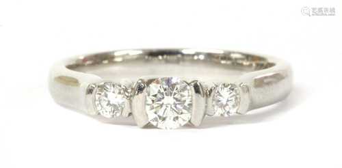 A platinum three stone diamond ring,