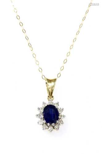 A gold sapphire and diamond cluster pendant,