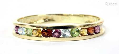 A gold assorted gemstone half eternity ring,