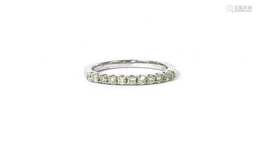 A 9ct white gold diamond half eternity ring,