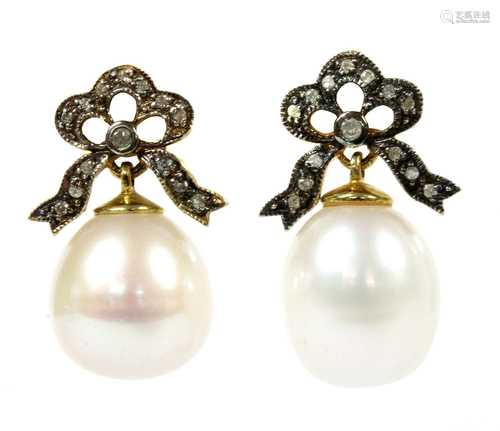 A pair of silver and gold cultured freshwater pearl and diam...