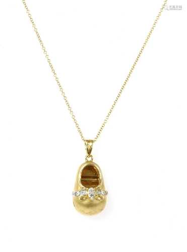 An 18ct gold diamond set shoe pendant,