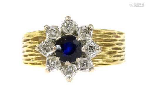 A gold sapphire and diamond flower cluster ring, c.1980,