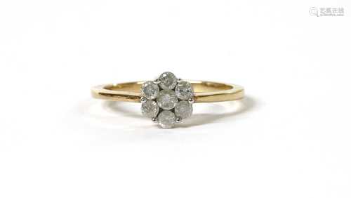 A gold diamond daisy cluster ring,