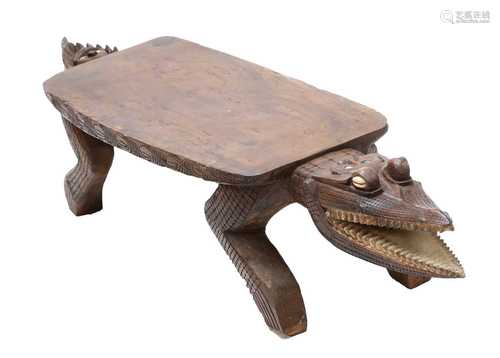 AN AFRICAN TRIBAL HARDWOOD STOOL,