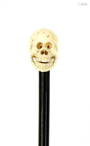 AN IVORY SKULL CANE,