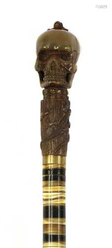 A BONE SKULL WALKING CANE,