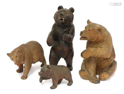 Four carved wooden Black Forest bears,