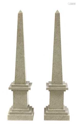 A pair of grey flecked marble obelisks