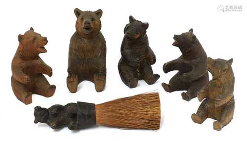 A group of five carved wooden Black Forest bears,