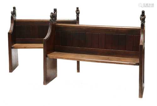 A near pair of oak church pews,