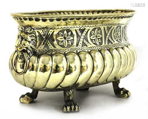 A repoussé brass wine cooler/jardinière,