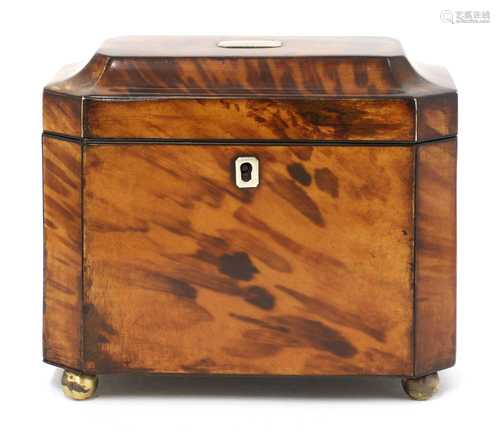 A tortoiseshell tea caddy,