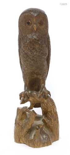 A Black Forest carved softwood owl,