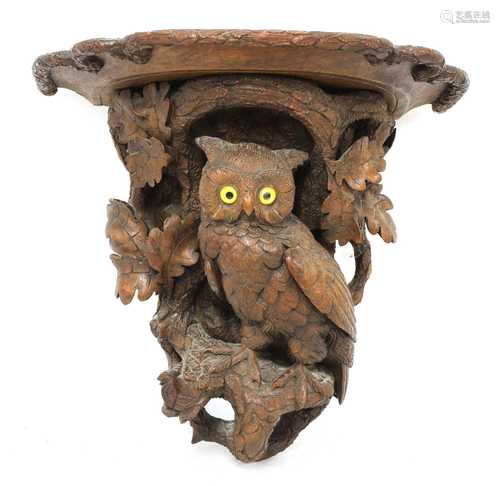 A Black Forest carved softwood wall bracket,