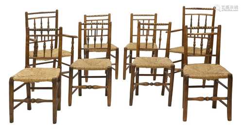 A matched set of eight oak and elm rush seated chairs