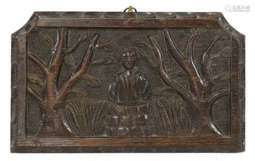 A primitive carved oak panel,