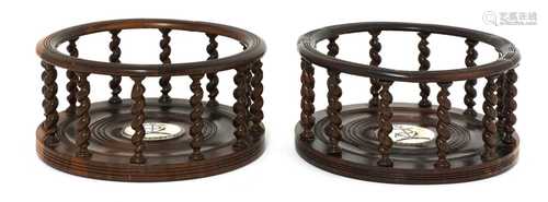 A pair of lignum vitae bottle coasters,