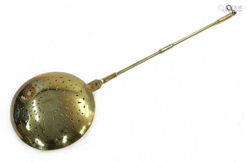 A brass warming pan,