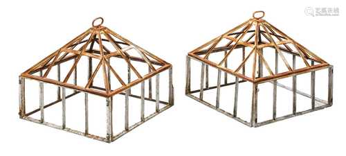 A pair of iron garden cloches,