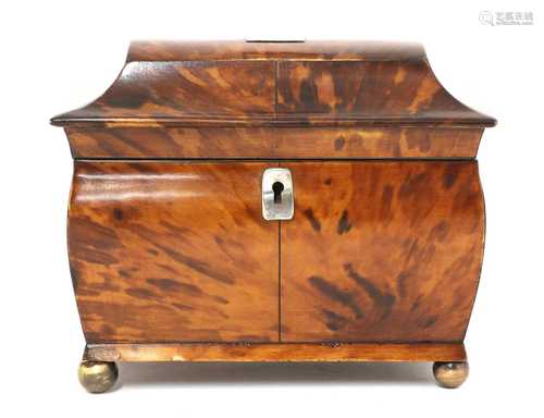 A tortoiseshell tea caddy,