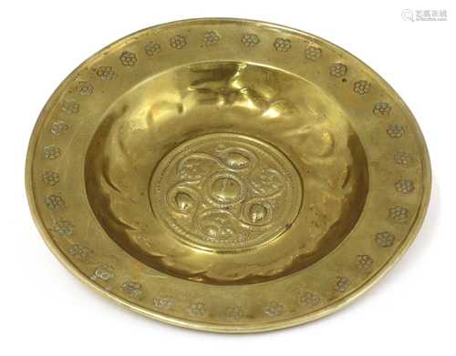 A small brass alms dish