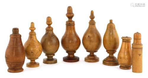 A collection of eight treen powders and shakers