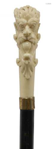 An ivory and ebonised walking stick,