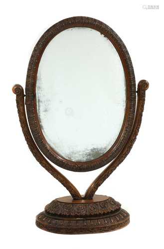 An Anglo-Indian carved padouk or rosewood dressing mirror