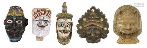 Four South Asian polychrome painted masks,