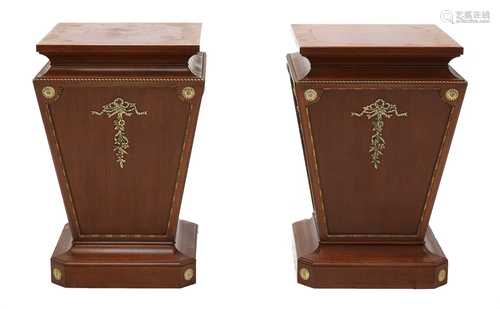 A pair of mahogany pedestals,