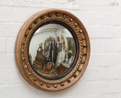 A George III-style gilt-framed convex wall mirror,