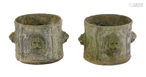 A pair of circular lead planters