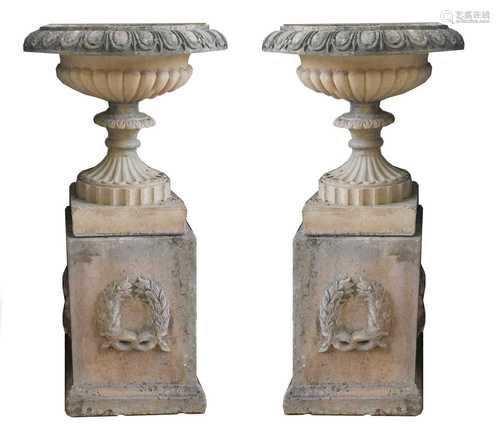 A pair of blush terracotta garden urns,