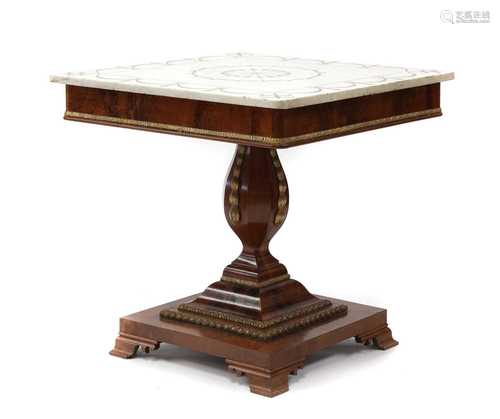 A flame mahogany and parcel-gilt pedestal centre table,