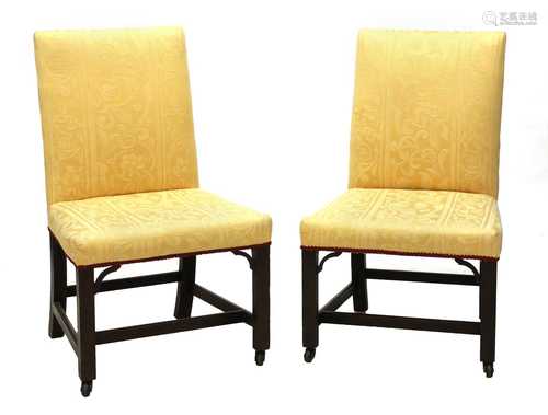 A pair of Chippendale period single library chairs