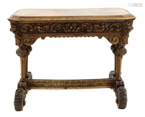 A carved oak centre table,