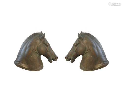 A pair of cast bronze horse heads,