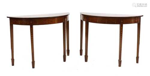 A pair of George III inlaid mahogany demilune console tables...