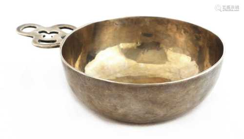 A silver wine taster or bleeding bowl,